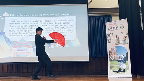 Mr. Li demonstrating the Tai Chi fan