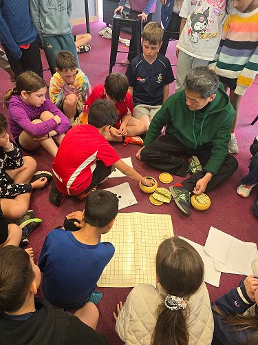 During Mandarin Language week, the Confucius Institute sent us volunteers to teach us a range of chinese games, skills and crafts. This is a popular game called "Go"