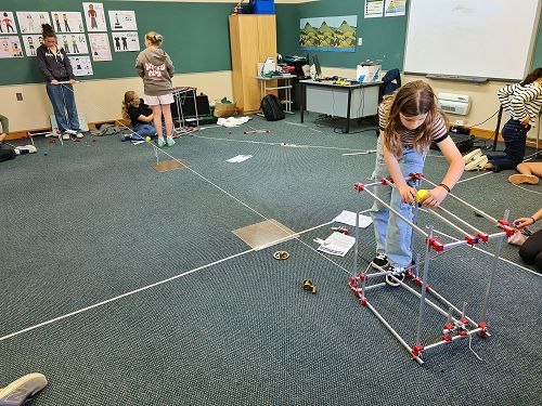 Abrielle and Nia test their ball launcher