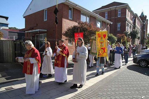 The servers lead the Palm Sunday procession to All Saints Dunedin