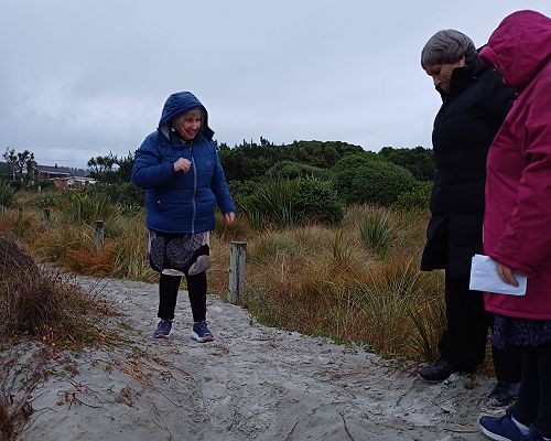 The Ven. Jan Clark leads the dawn service on Brighton Beach, Easter Sunday.