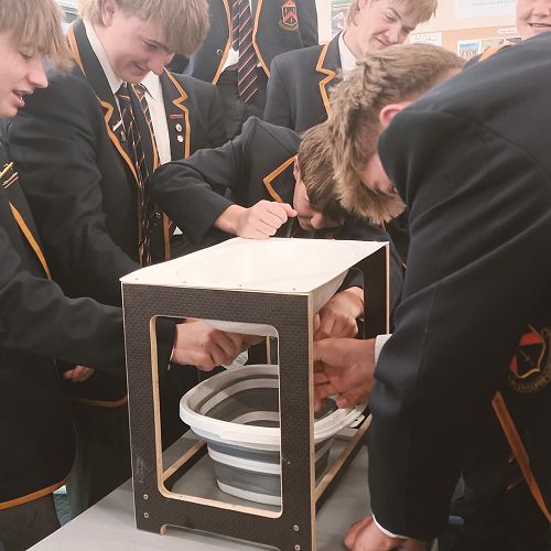 Year 11 Agriculture trying to 'milk' a practice udder.