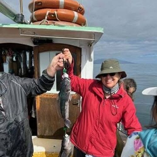 Bishop Anne hooks a catch off Rakiura - Stewart Island