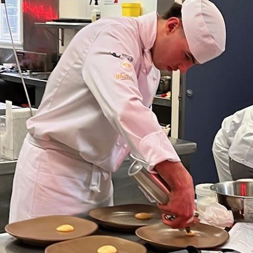 Luke Miller getting busy plating at the chef nationals