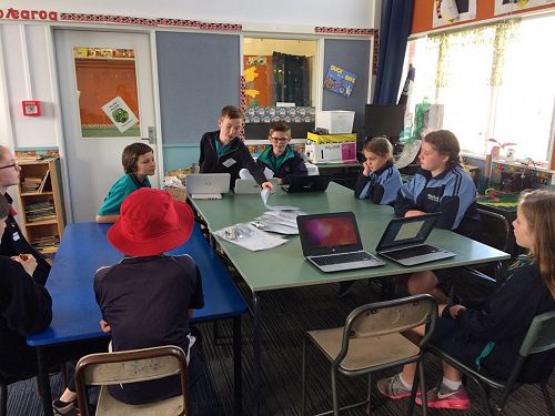 Kobe and Asher running a workshop