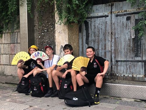 Trying to keep cool with the Fans they designed.