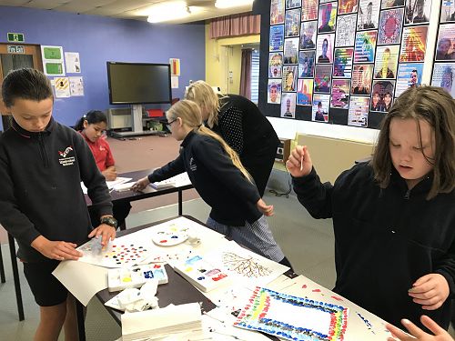 Finger painting in action.