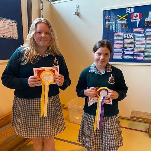 In this morning's assembly, Summer Pay and Emily Anderson received prizes for their artwork from this year's A & P show.