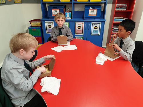 The boys enjoying their fish n chips