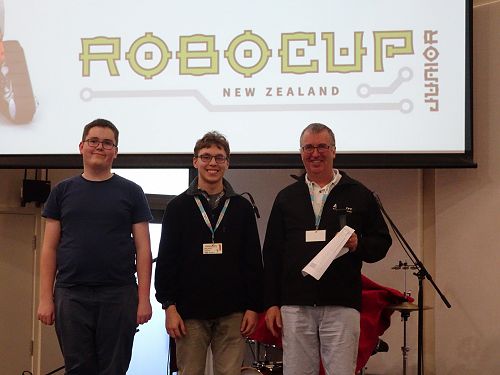 Constructobots. From left; Mitchell Lloyd and Riley Symon with Donald Liddell (Otago Robotics Education Committee Chairman).