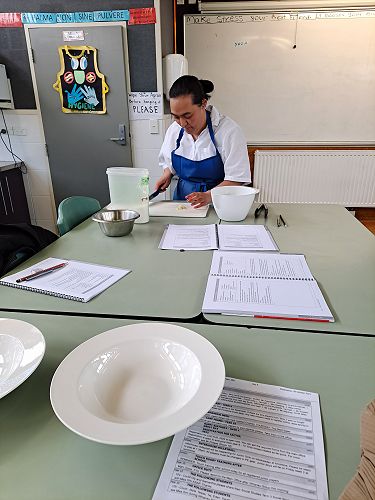 Ashanti preparing a chicken salad for her Level 2 NCEA Home Economics Assessment