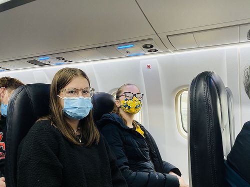 Maya and Darcy on the plane