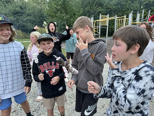 Tanesha and Lucas photo bombing as Xion enjoys his marshmallows