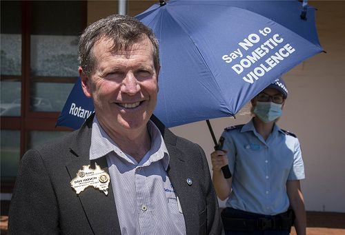 DGN Dave Harmon at presentation of Umbrellas to Ballina Police, Ballina Domestic Violence Liaison Officer Constable Jenna Aslin in background
