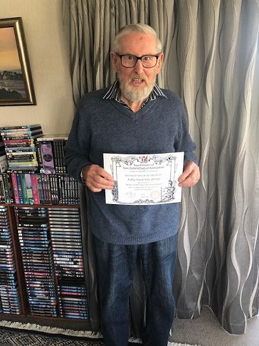 Ashley Weir, JP (Retired) receiving his certificate