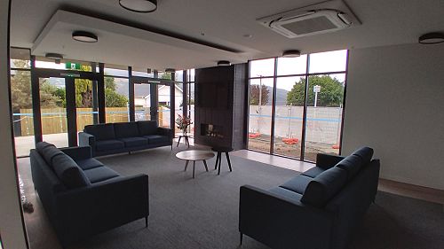 Boarding Village Redevelopment - Downstairs lounge with fireplace