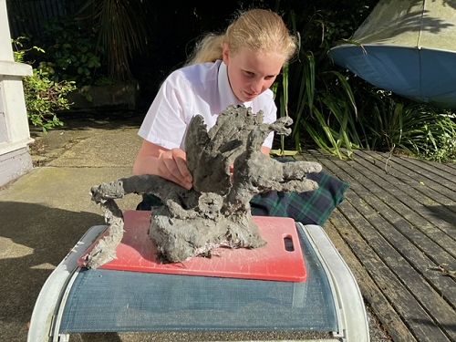 Elizabeth Dearden crafted a dragon for her family's garden -  first from crumpled foil and then covered with concrete.