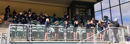 Students in the stand trying to keep warm between races.