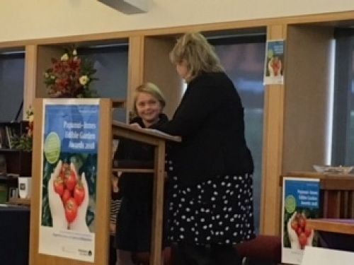 Phoenix explaining to Ali Jones, (CCC Councillor) about the Wairakei School garden.