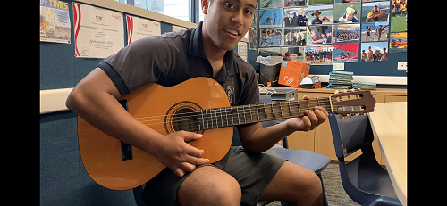 Riki was eager to learn how to play the guitar and worked hard to learn new chords and different strumming patterns. 