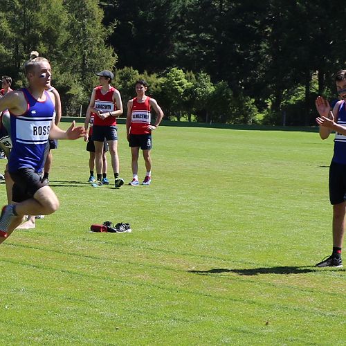 Taylor Mechen carries Ross Home with a decisive lead in the Senior Relay cheered on by Jordan Gain.