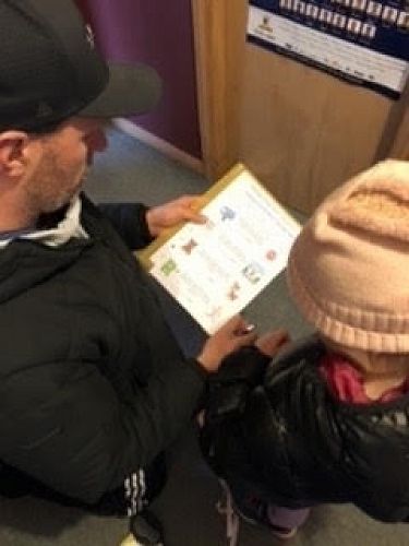 Cailtyn McAuley (Year 1) and her Dad getting ready for a walking 'Treasure Hunt'