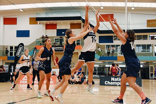 Action shot of the Elite Basketball girls