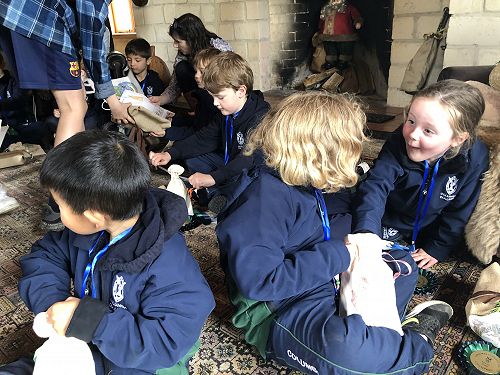 Excited children opening their Christmas stockings