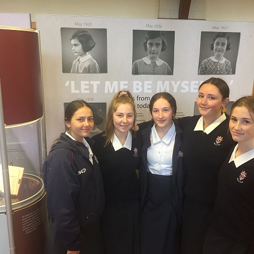 10HR students next to a replica of Anne Frank's diary. (L-R) Pippa Sherriff, Katie Pullar, Georgia Loach, Eva Tindall-Morice, Lillie Hawkins