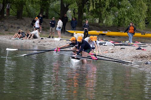 Oars in, getting ready to race.