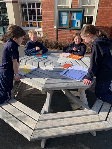 Evelyn Cosgrove begins the meeting by retelling the main events from the chapters studied