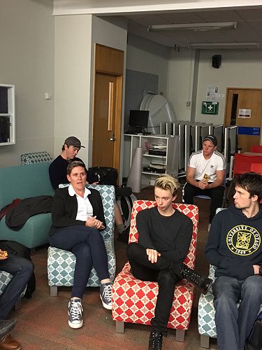 Rebs talking and Finn, Dion, David listening. 