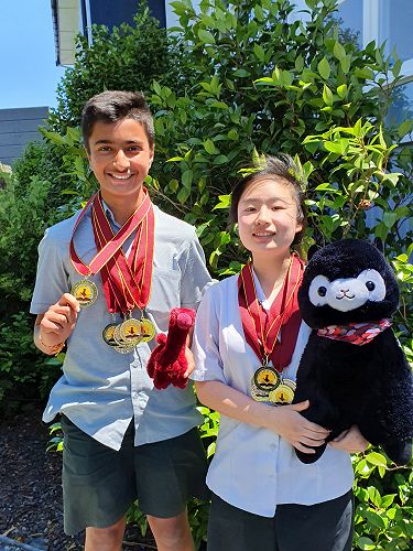 Ameya Raut 9SOSC and Lucia Guo 9SHTR with their medals from the World Scholars Cup Tournament of Champions.