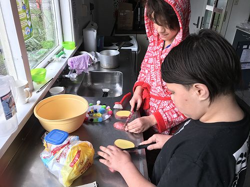Lerome and Lukas preparing the potato.