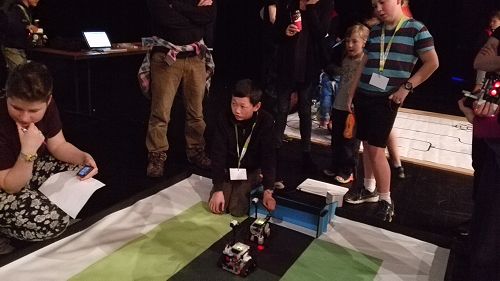 Jack and Eric are hoping the robot will score!