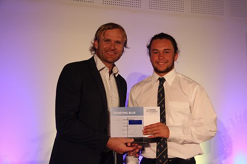 Scott Robertson presents Caleb Makene with his Lincoln University  Blue for Rugby