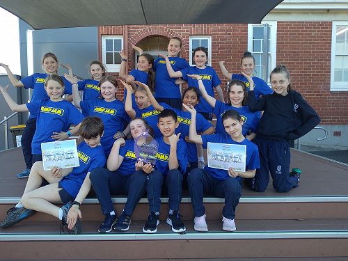 Caption:  Relaxation and pride with their winning certificates and trophy