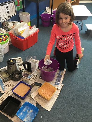 Opal Dean showing us how the paper is made.