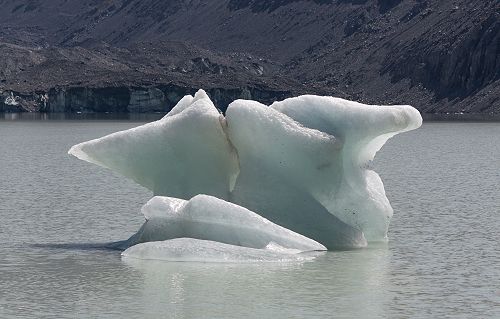Iceberg on the Hooker Glacier terminal lake. The terminal face of the Hooker Glacier can be seen in the background.