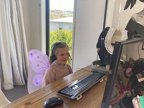 Eva Munro (Year 1) dressed in her fairy wings watching our class Google meet