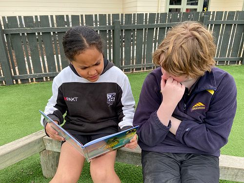 Angela reading with her buddy Sunny