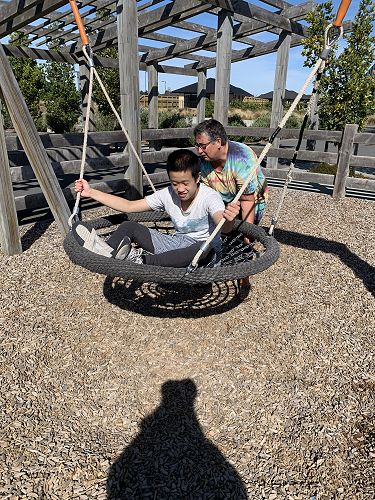 Basket swings are very popular with the Room 10 students. Timothy and Robyn are playing. 