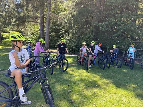 Getting bikes checked and instructions before heading off to bike in the mountains (slight hills)