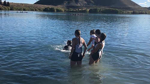 Celebrating by throwing the cox into the lake