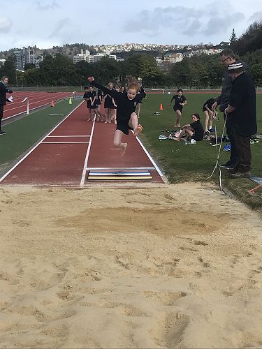 Ruby N. flying into the Long Jump pit.