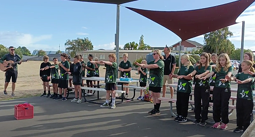 Broadgreen Intermediate with Fergus Knight from Sport Tasman singing a waiata to Nayland College PE students