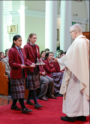 Students presenting the gifts at Mass