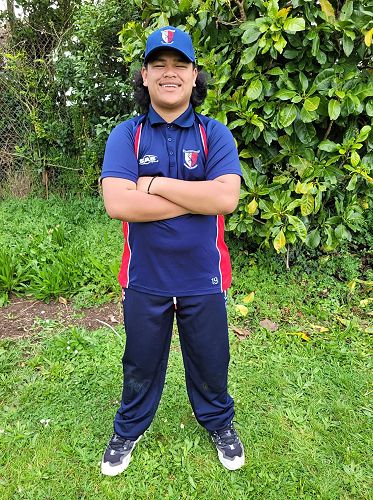 Playing cricket for his team