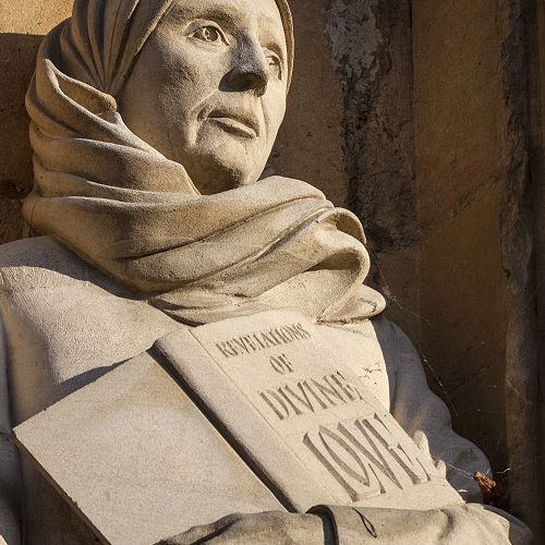 Sculpture of Julian of Norwich on exterior West Porch of Norwich Cathedral.