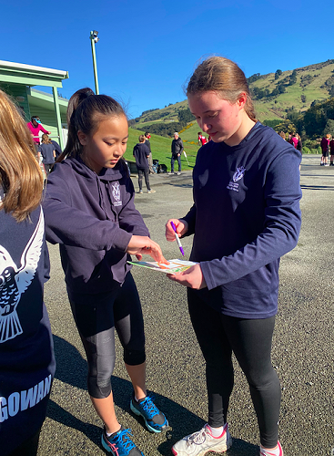Crystal Chiang and Mia Revell-Lynch working together in the orienteering challenge 
